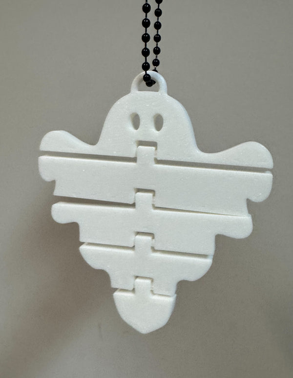 White floppy ghost 3D printed keychain with a black chain