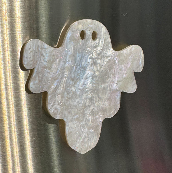 Ghost shaped magnet in white shimmer acrylic on a stainless steel fridge
